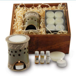 re-useable wooden box, unique pottery oil burner, 6 tealights, 1 wax melt, 3 different fragrances.