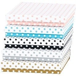 A CD Box with a polka dot design with a cover can hold one CD.