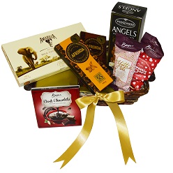 Choc hamper I includes wedgewood biscuits, 2 x yotti nuggets, beyers dark choc slab, 2 x afikoa slabs, box amarula chocolates packed in a basket