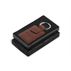 simulated leather & polished chrome plating, presentation box, At a time when all businesses are looking out for creative corporate branding solutions, stand out from the competition by gifting your clients this contemporary faux leather keyholder that is simple yet sassy. Made of high-quality material, the sleek keyholder is fit for daily use. This smart piece comes with an attractive presentation box that adds to its appeal.