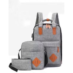 Laptop backpack with USB Charging, crossbody bag and carry pouch.