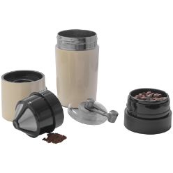 Coffee mug with build in coffee grinder