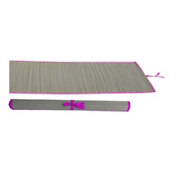 The Grass beach mat is brown in color but has a pink trim color, as the name implies it is mostly used at the beach to relax sit or unpack your beach items. Itâ€™s used at home for morning exercise or yoga, the mat has a pink rope used to tie it bound when not in use, this mat can be placed in grass to avoid stains or wetness from the garden.
