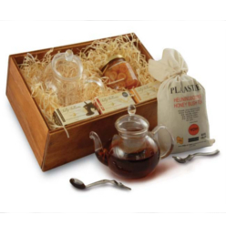 Re-useable wooden box, glass teapot, honeybush tes, 3 sally williams nougats, large jar of preserves, lady sugar spoon, wave teaspoon.