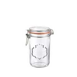 A small transparent jar, that holds 750ml of any liquid substance, it also hold solid or molten substances but in small quantity, has a fancy cork that stays around the neck of the jar, can be buckled to prevent spilling of content, carries little amount of substance, it's a pocket size so no worries of where to keep it, can stand freely on a surface because of its flat bottom.
