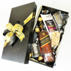 1x 750ml Johnnie Walker Black, 2x Glasses Whisky, 4x 1's Lindt Lindor Dark Chocolate Truffles, 1x 100g Lindt Execellence 70% Dark Cocoa Chocolate Slab, 4x 1's Ferrero Rocher Chocolates