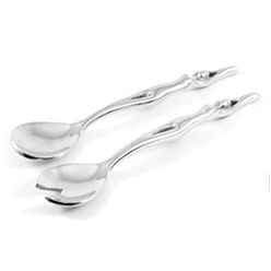 Salad servers with lady patterned handles made from aluminium