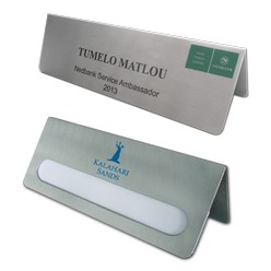 Are you looking for name stands for office use? Giftwrap offers a chance to equip the office with the simple name stands. These stands are made from 1.6mm aluminum that are changeable and reusable. The names can be changed easily without any extra effort. The color option available is embossing. It can be modified by digital printing. These stands are perfect fit for office spaces, desks, conference rooms, meetings and boardrooms.