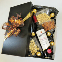 1x 750ml Wine - Nederburg Cab Sauv, 1x 75g Nuts Cashew Salted, 1x 75g · Nuts Macadamia Salted, 1x 75g Almonds Roasted & Salted, 6x 1's · Ferrero Rocher Chocolates