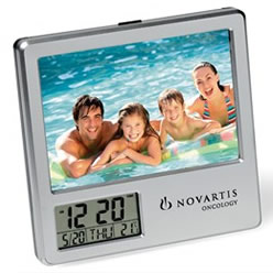 ABS , photo size 12.2 (w) x 9 (h), features time, date, temperature, alarm, 2x AAA batteries not included