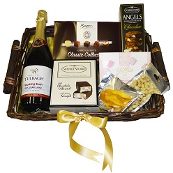 Red letter day II includes 100g mixed nuts, box of beyers chocolates, box of yotti turkish delight, wedgewood nougat, wedgewood biscuits, 30g dried mango and 1 x bottle of Becks champagne packed in a basket