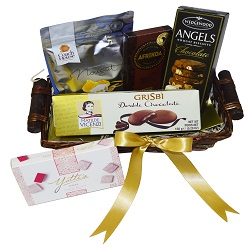 Sweet in a basket I includes afikoa slab, biscuit pack, wedgewood biscuits, yottis turkish delight, coach house nougat all packed in a basket