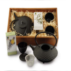 Re-useable wooden box, cast iron teapot – enamel lined, 2 cast iron tea cups, 1 cast iron trivet, 1 packet organic olive leaf tea