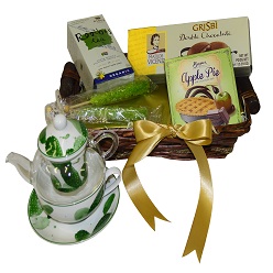 Tea in a basket and pot includes a tea cup and pot, rooibos organics tea, 180 g double choc biscuits, 2 x sugar sticks, beyers apple pie slab packed in basket