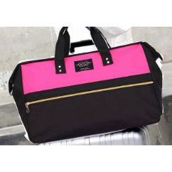 Large capacity travel bag with main zippered compartments and side zippered compartment and carry handles